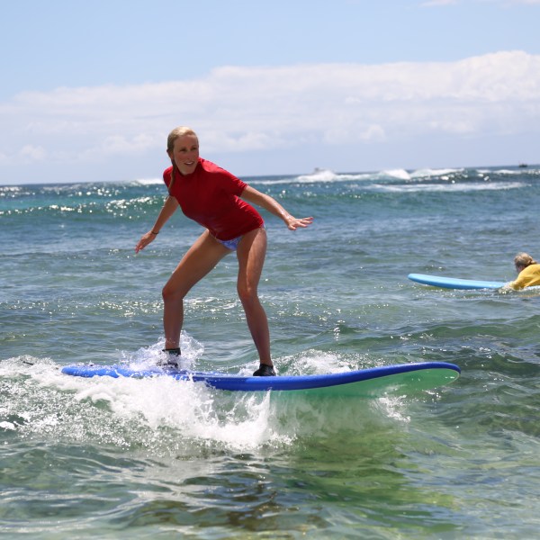 girl balancing on a surfboard