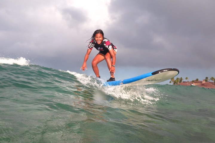 girl dropping in on a wave