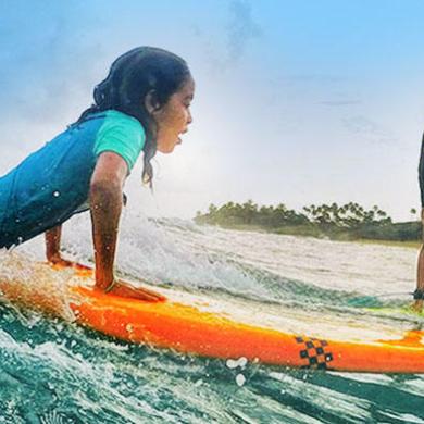 sisters learning to surf on rentals